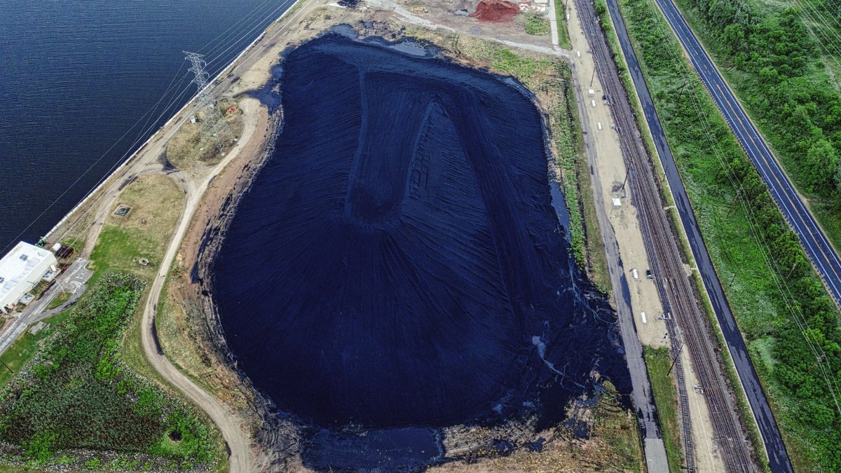 Drone shot of coal ash pond near Alma, Wisconsin highlighting environmental impact.