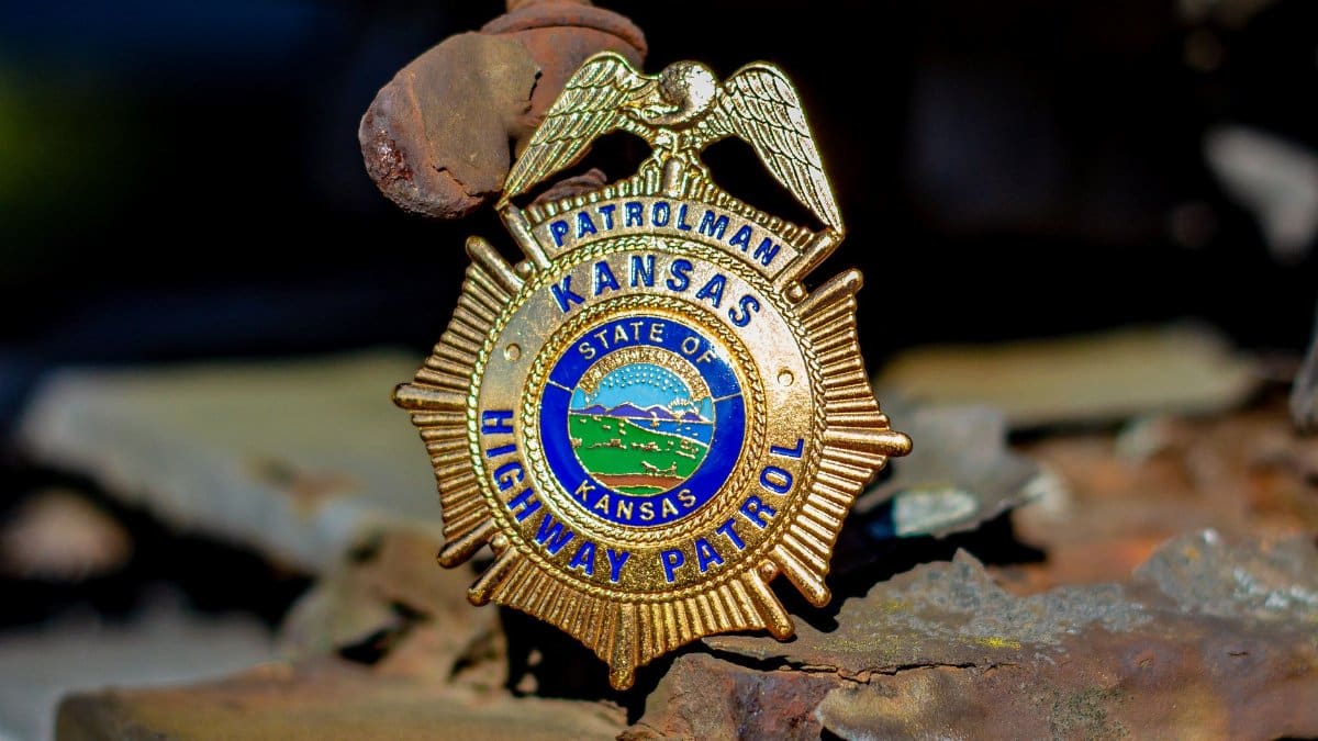 Close-up photo of the Kansas Highway Patrol badge, showcasing intricate design details.