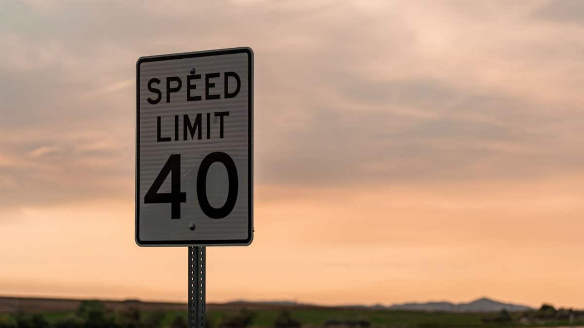 Captivating speed limit sign against a rural Utah sunset sky.