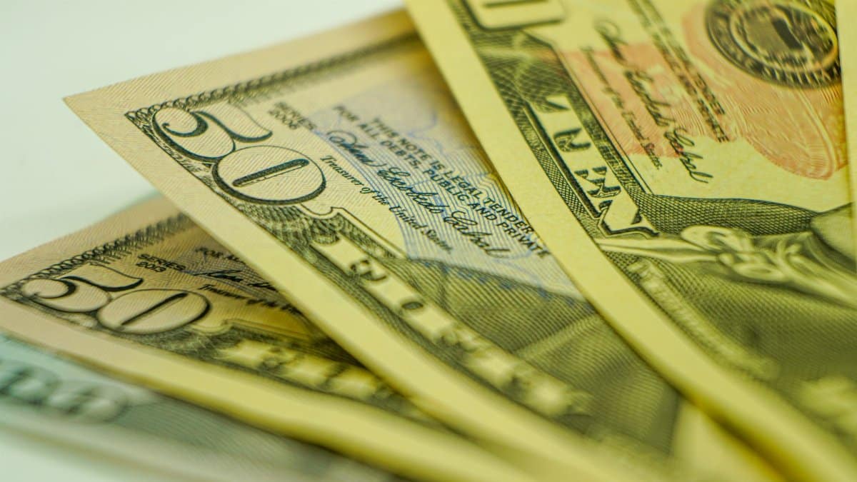 Macro shot of American dollar bills displaying currency detail for finance-related concepts.