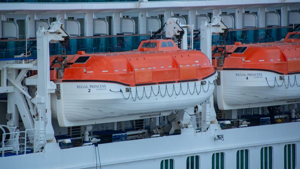 Close-up view of lifeboats aboard the Regal Princess cruise ship, highlighting maritime safety features.