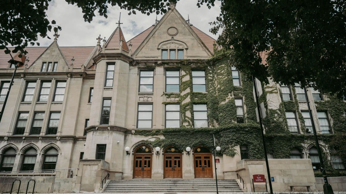 Majestic ivy-covered Gothic architecture of a historic university building in Chicago.
