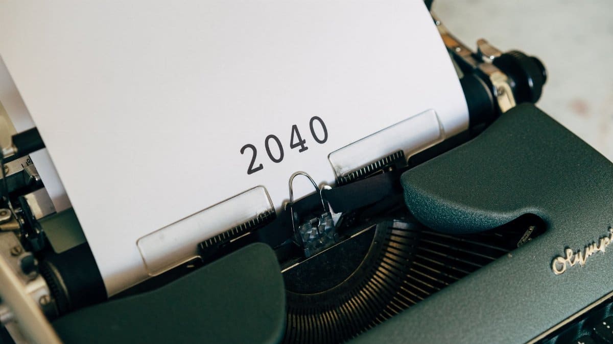 Close-up of a vintage typewriter with a paper showing the year 2040, capturing a nostalgic yet futuristic feel.