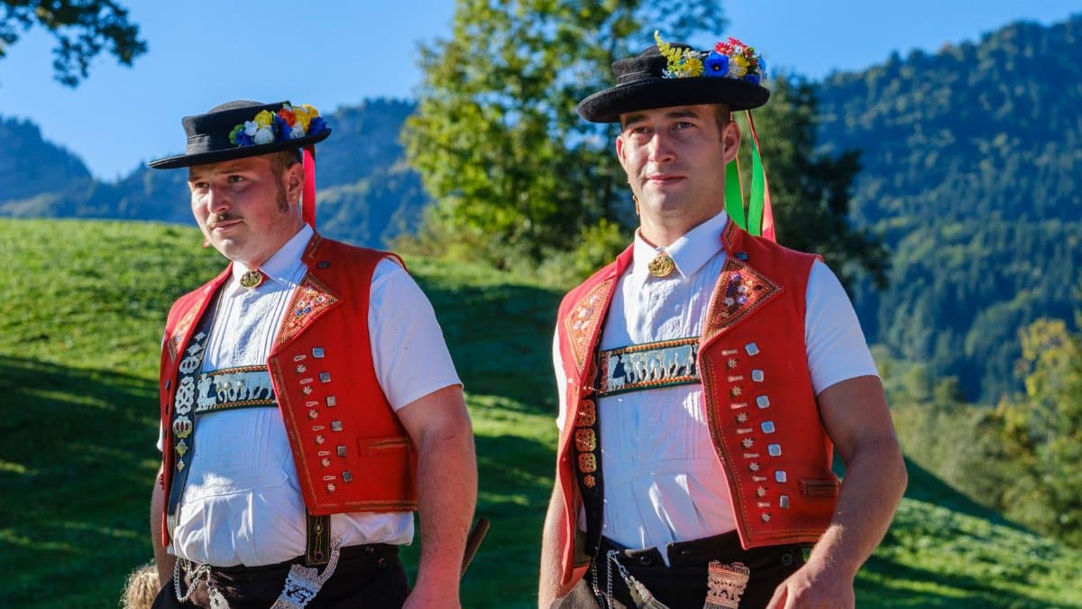 Men in traditional Swiss attire enjoying the outdoors in Appenzell Ausserrhoden.