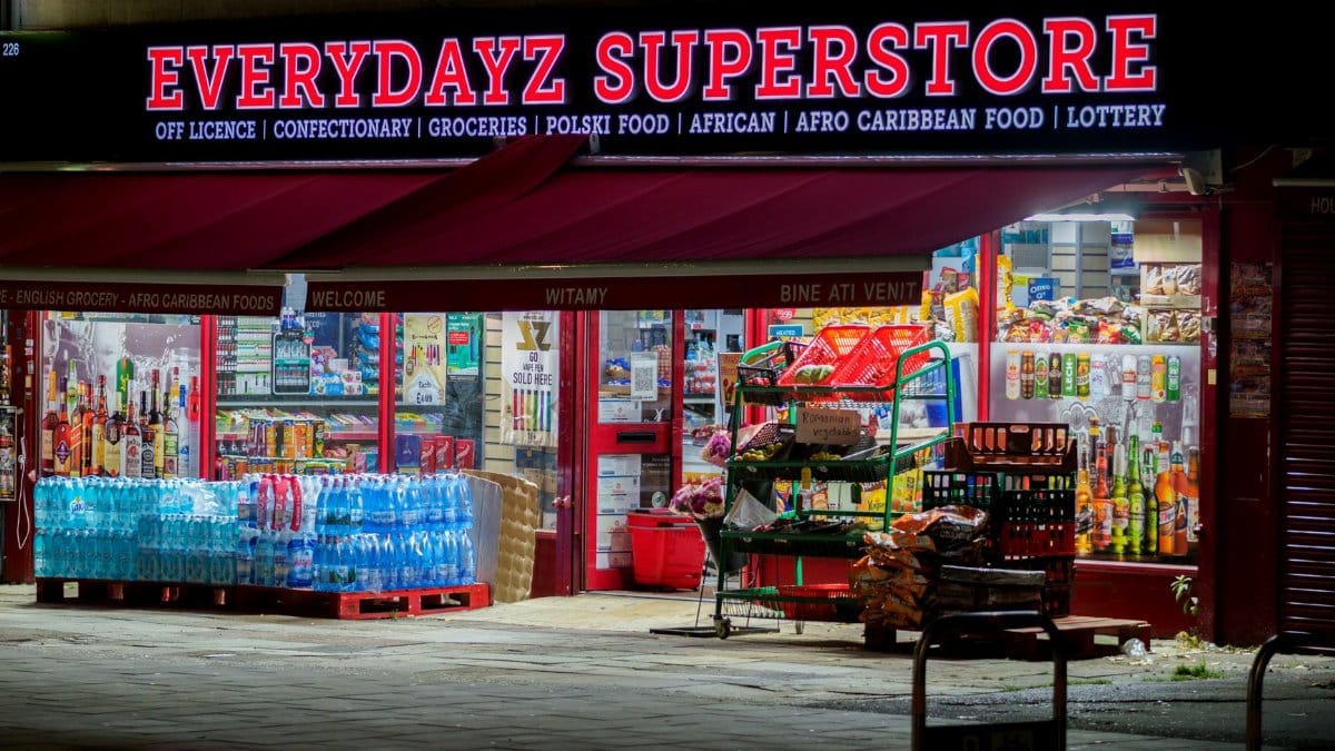 Illuminated night view of Everydayz Superstore, showcasing diverse products and cultural groceries.