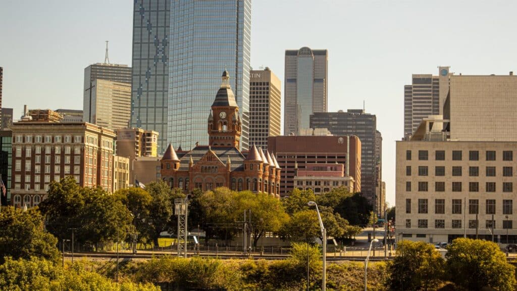 Scenic view of Dallas skyline featuring the Old Red Museum and skyscrapers.