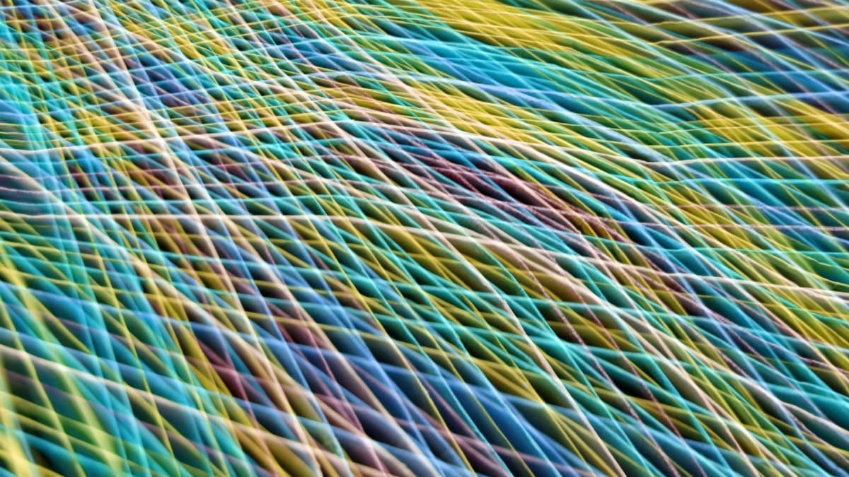 Dynamic multicolored abstract pattern resembling waves, captured in Guaratuba, Brazil.