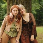 Friends enjoying a moment in a serene forest environment, embracing positivity and togetherness.