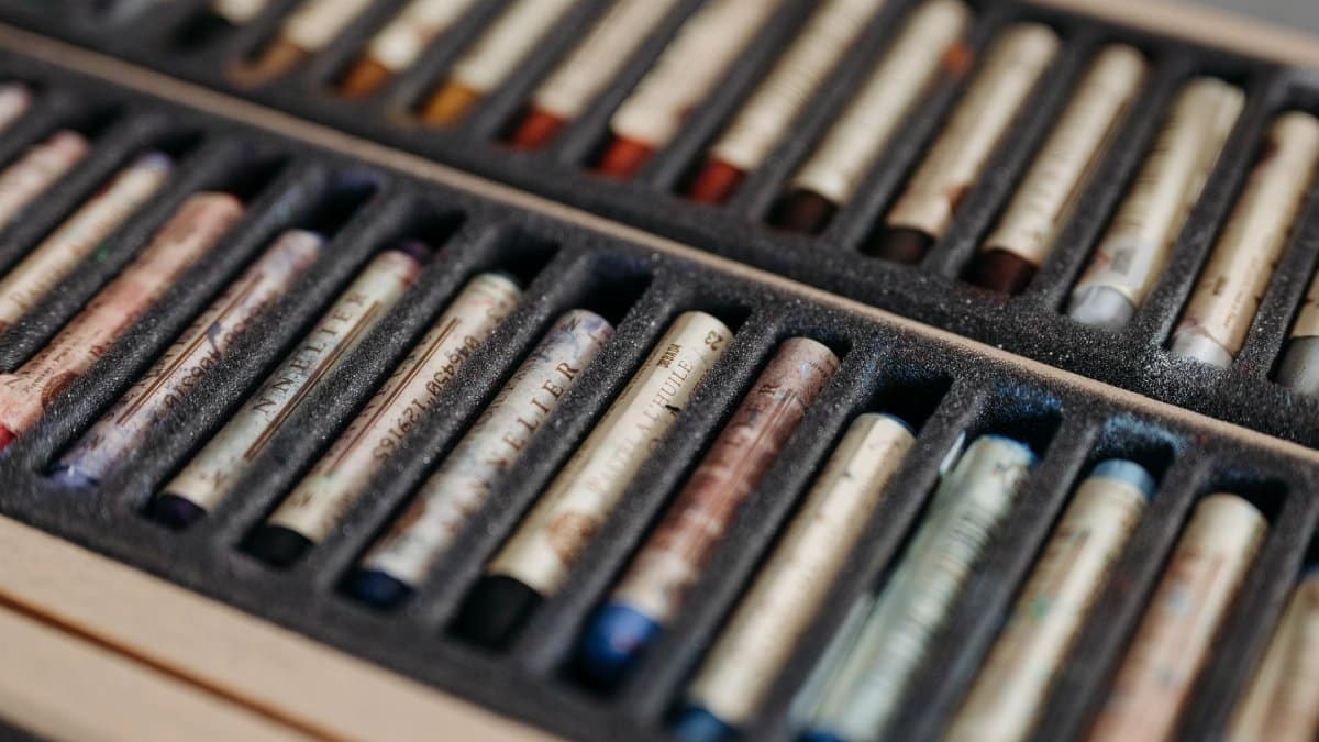 Vibrant pastels neatly arranged in a case, ideal for artistic creativity.