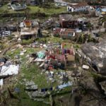 Aerial photo showing extensive hurricane damage in a residential area.