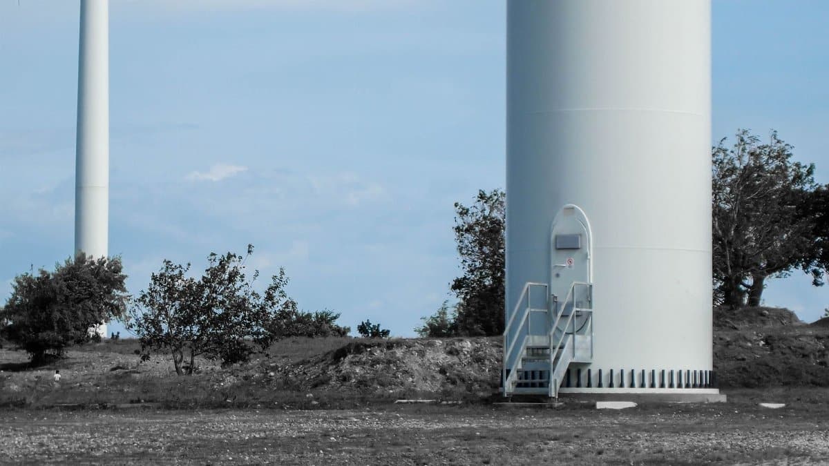 Close-up view of a wind turbine entrance at a wind farm, showcasing renewable energy technology.