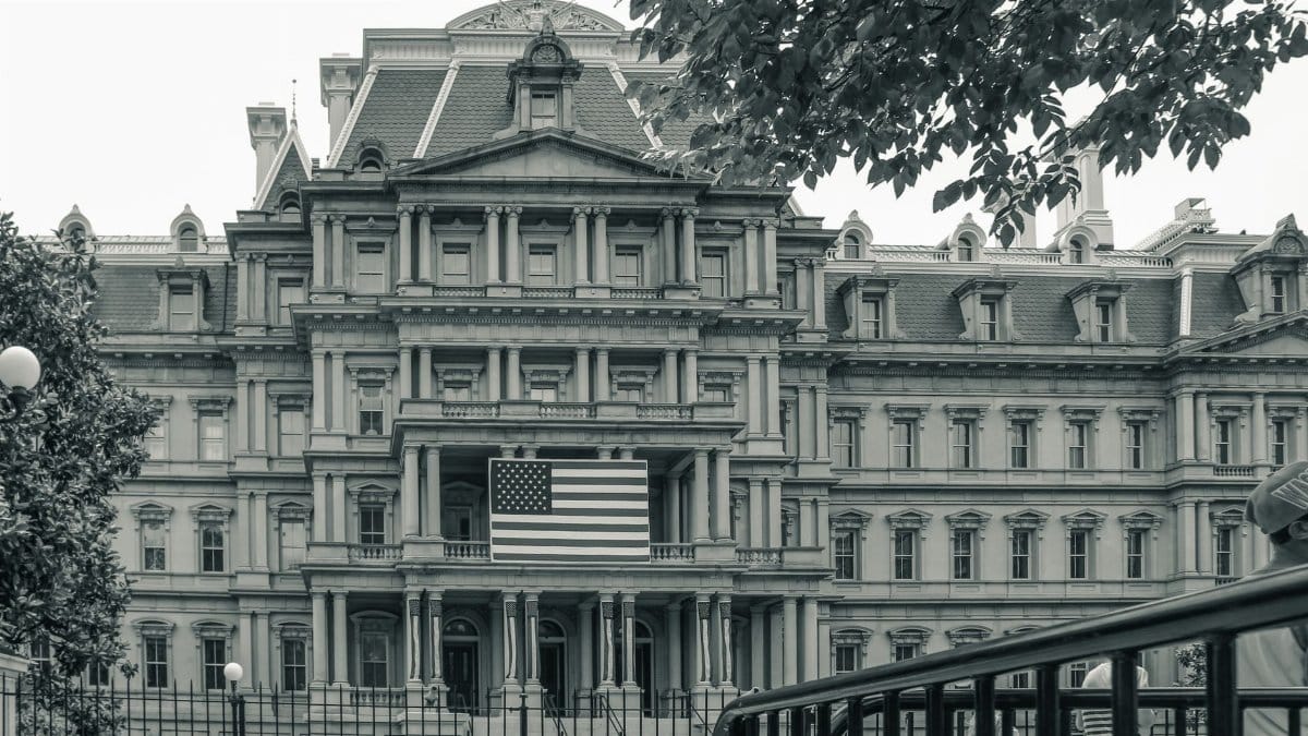 View of the Eisenhower Executive Office Building in Washington with American flag.