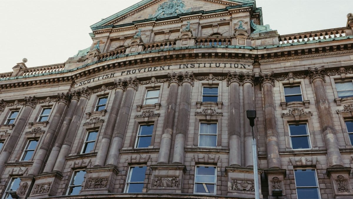 A detailed view of the historic Scottish Provident Institution Building in Belfast, Northern Ireland.