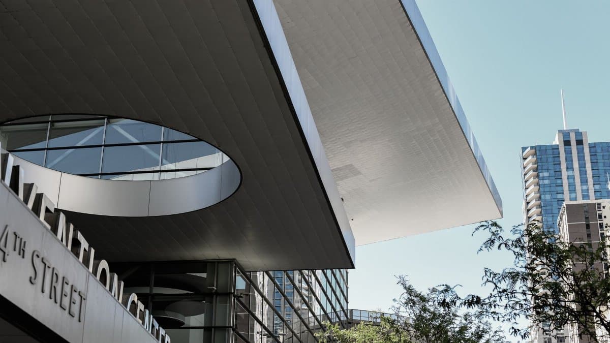 Dynamic view of the Denver Convention Center's architecture with city skyline.