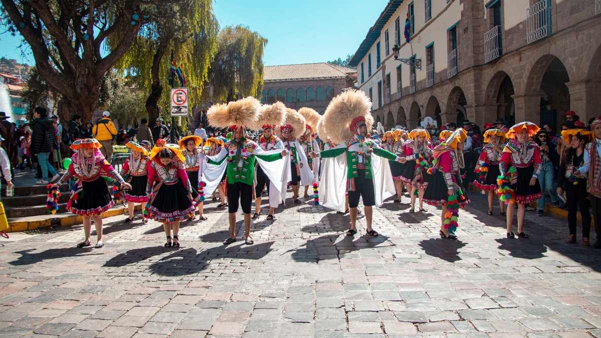Vibrant traditional festival parade in Cusco, showcasing cultural costumes and dance.