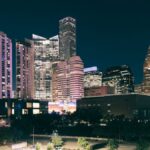 Spectacular night view of the illuminated Houston skyline with modern skyscrapers.