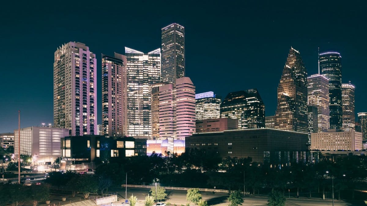 Spectacular night view of the illuminated Houston skyline with modern skyscrapers.