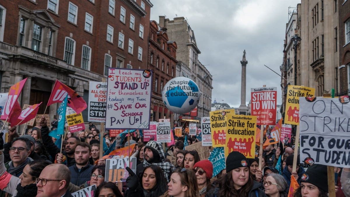 A vibrant demonstration in London advocating for educational reform and support.