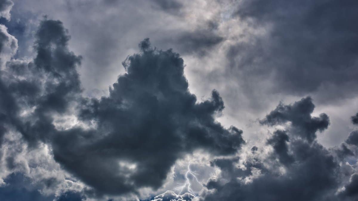 An intense storm sky showcasing dark clouds and vivid lightning, capturing nature's power.