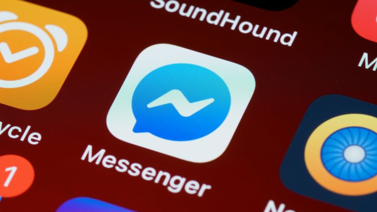 A detailed view of a smartphone screen displaying various app icons including Messenger and SoundHound.