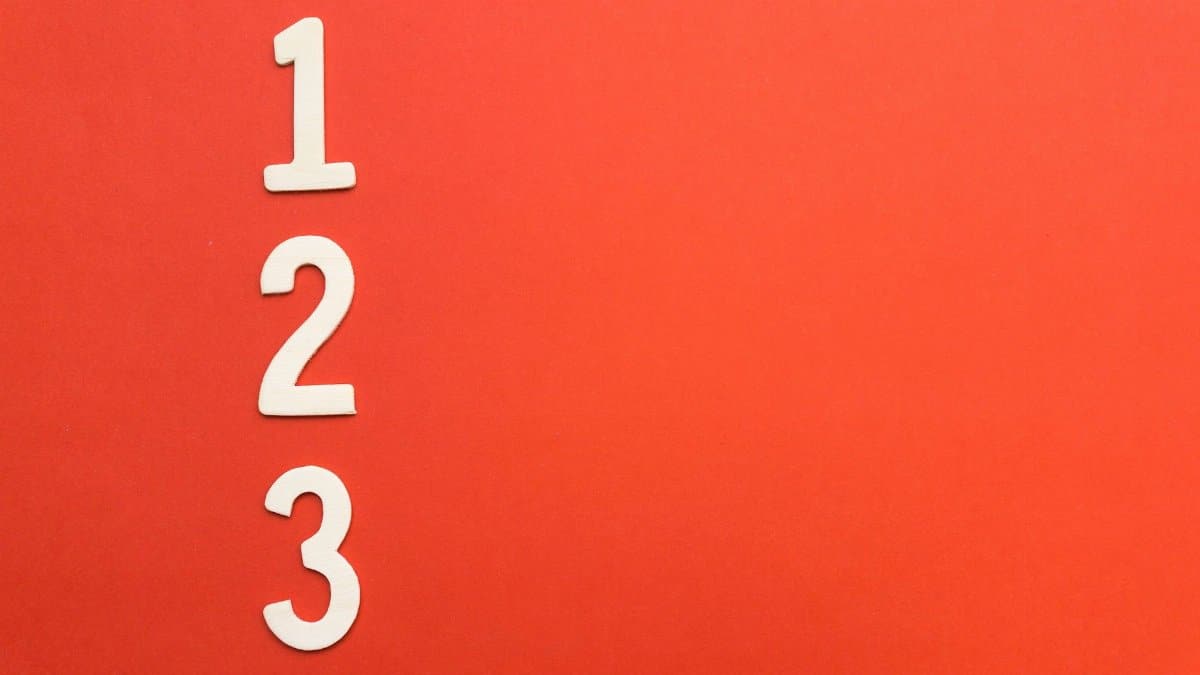 Counting numbers 1 to 3 on a vibrant red background, ideal for design projects.