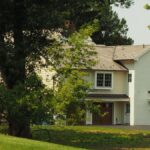 A serene suburban home nestled among trees, showcasing traditional architecture in Pennsylvania.