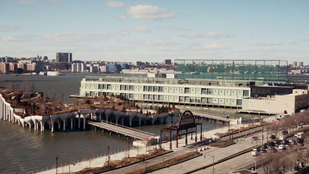 Aerial view of Pier 57 and surrounding area in New York City with the Hudson River in the background.