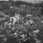 Aerial view of hurricane damage in St. James Parish, Jamaica, showing destroyed homes.