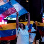 Joyful Venezuelans celebrating with flags in the streets of Buenos Aires, Argentina.