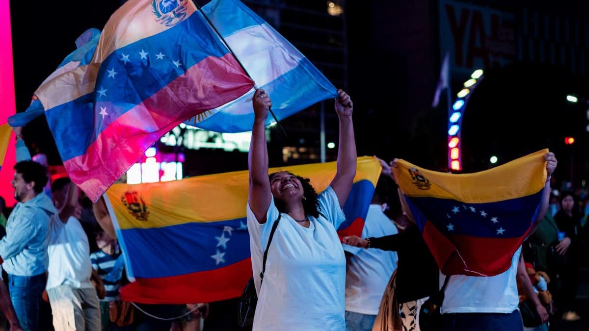 Joyful Venezuelans celebrating with flags in the streets of Buenos Aires, Argentina.