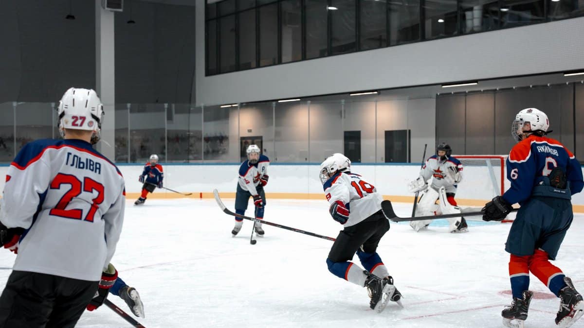 Action-packed ice hockey game with players competing in an indoor arena.