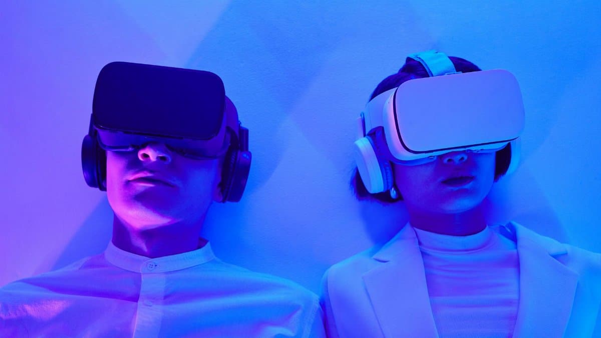 Two people immersed in VR, highlighting future technology and virtual engagement.