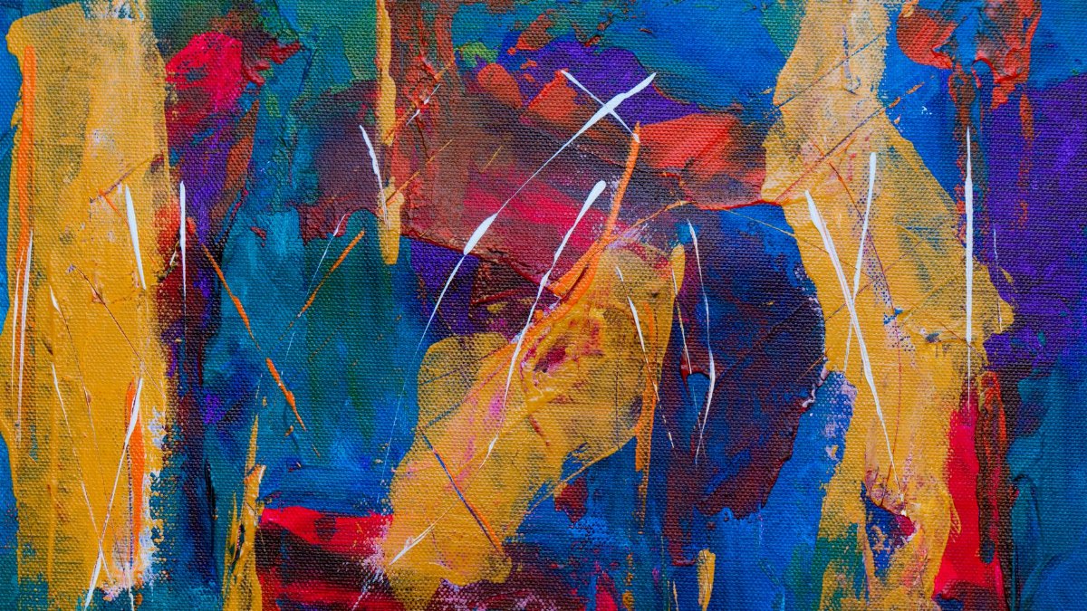 Dynamic abstract artwork featuring bold colors and expressive brushstrokes on canvas.