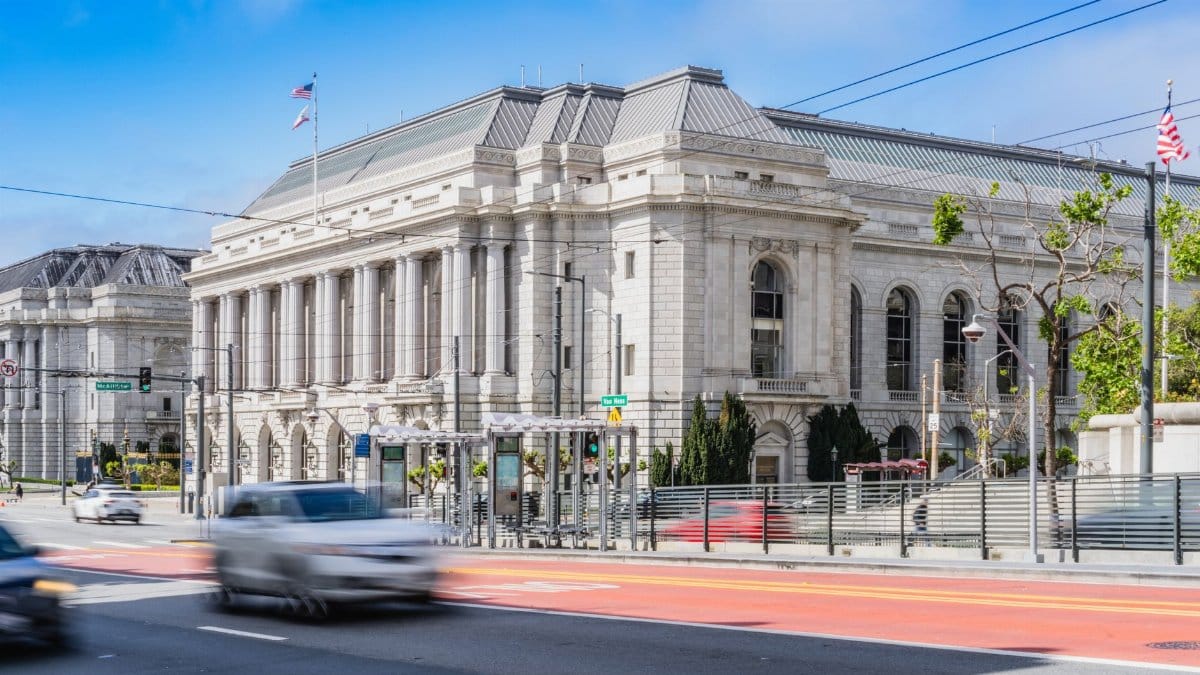 Elegant historic architecture photographed in San Francisco's Civic Center, capturing urban movement.