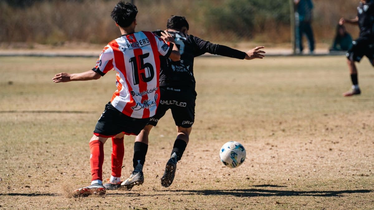 Action-packed soccer game with players competing aggressively outdoors.