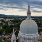 Aerial view capturing a basilica dome set against the picturesque Winona, MN landscape.