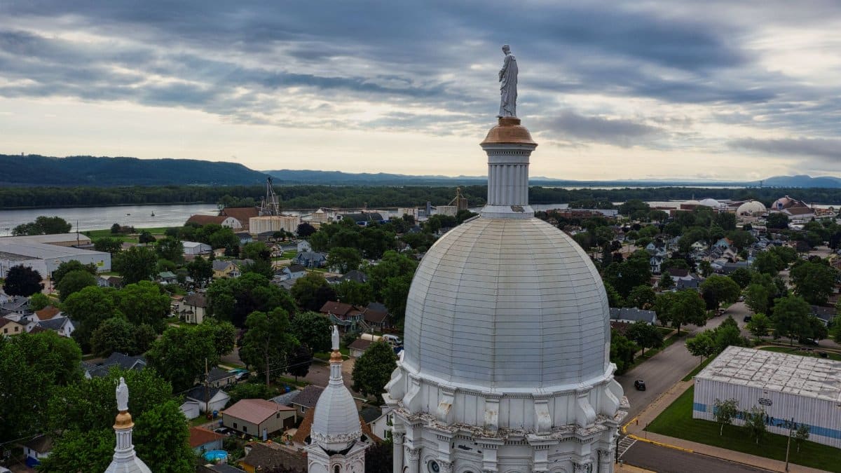 Aerial view capturing a basilica dome set against the picturesque Winona, MN landscape.