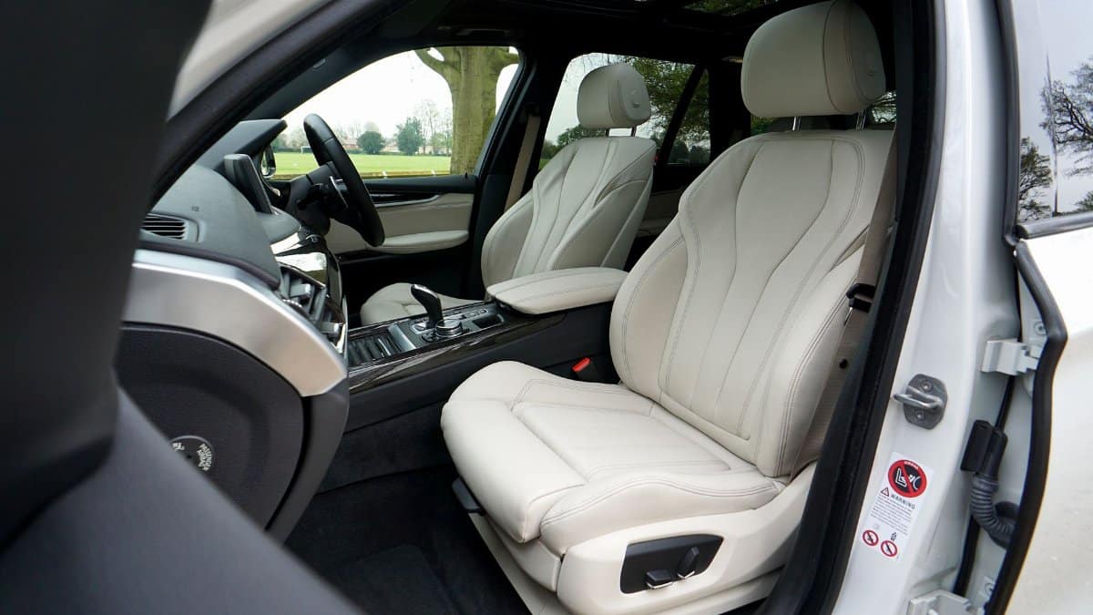 Premium white leather car interior showcasing luxury and comfort features. Ideal for automotive design enthusiasts.