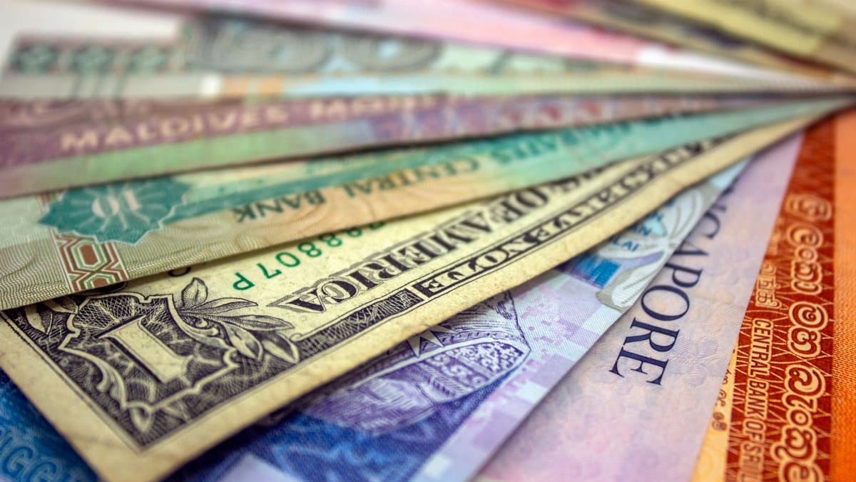 A close-up view of various international banknotes showcasing diverse currencies.