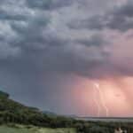 Captivating view of a thunderstorm with lightning over rolling hills in Nelson, Wisconsin.