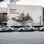 Sheriff vehicles parked outside the Seminole County Courthouse, capturing law enforcement presence.