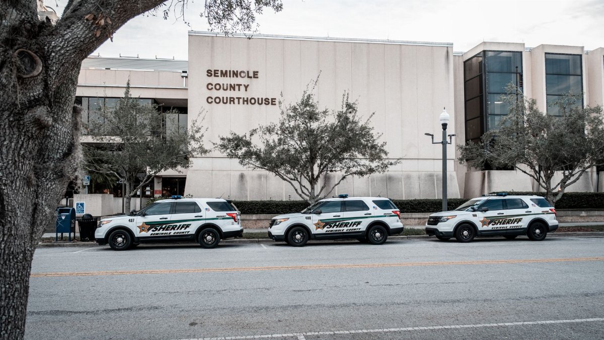 Sheriff vehicles parked outside the Seminole County Courthouse, capturing law enforcement presence.