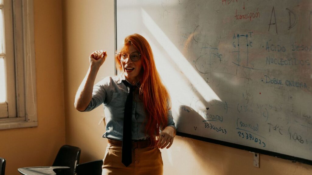 A university educator engaging students with a lecture in a Buenos Aires classroom.
