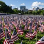 A field of American flags in Boston Common on a clear day, honoring Memorial Day.