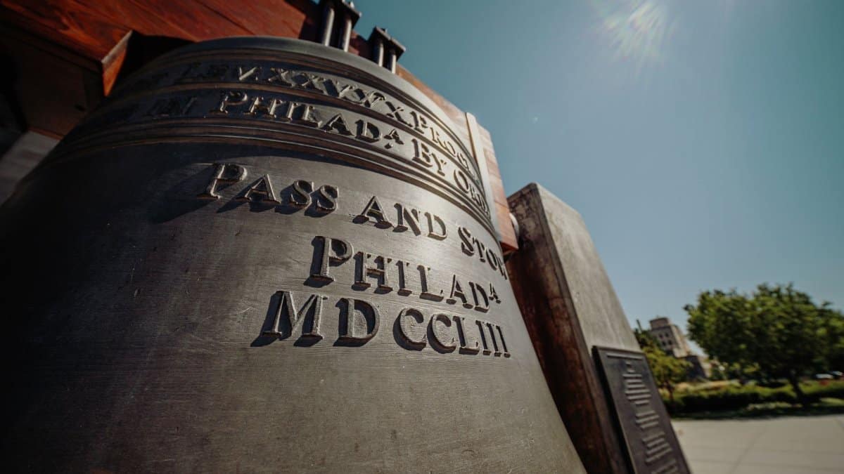 From below of view of monument of liberty Pass and Stow bell located on street at sunny day