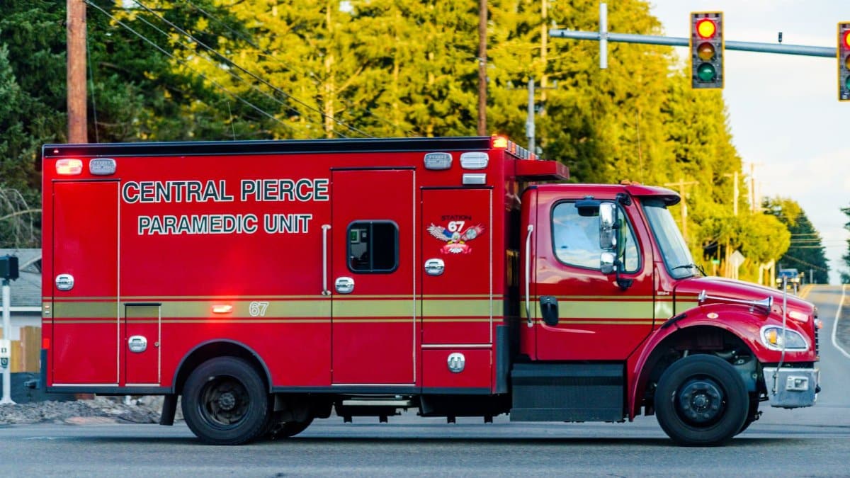 Red paramedic truck from Central Pierce seen at an intersection, providing emergency services.