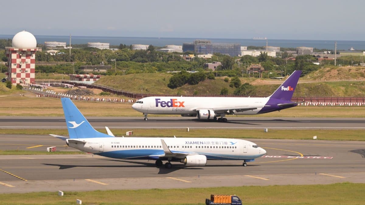FedEx and Xiamen Air planes on runway at Taoyuan International Airport in Taiwan.