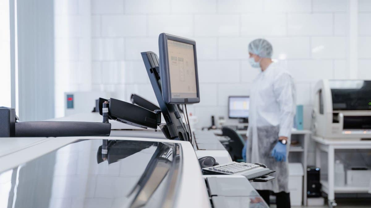 Lab technician working in a modern research facility, focusing on technology and healthcare.