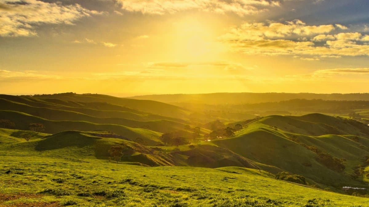 Beautiful sunrise over rolling hills in Yankalilla, South Australia, capturing nature's tranquility.