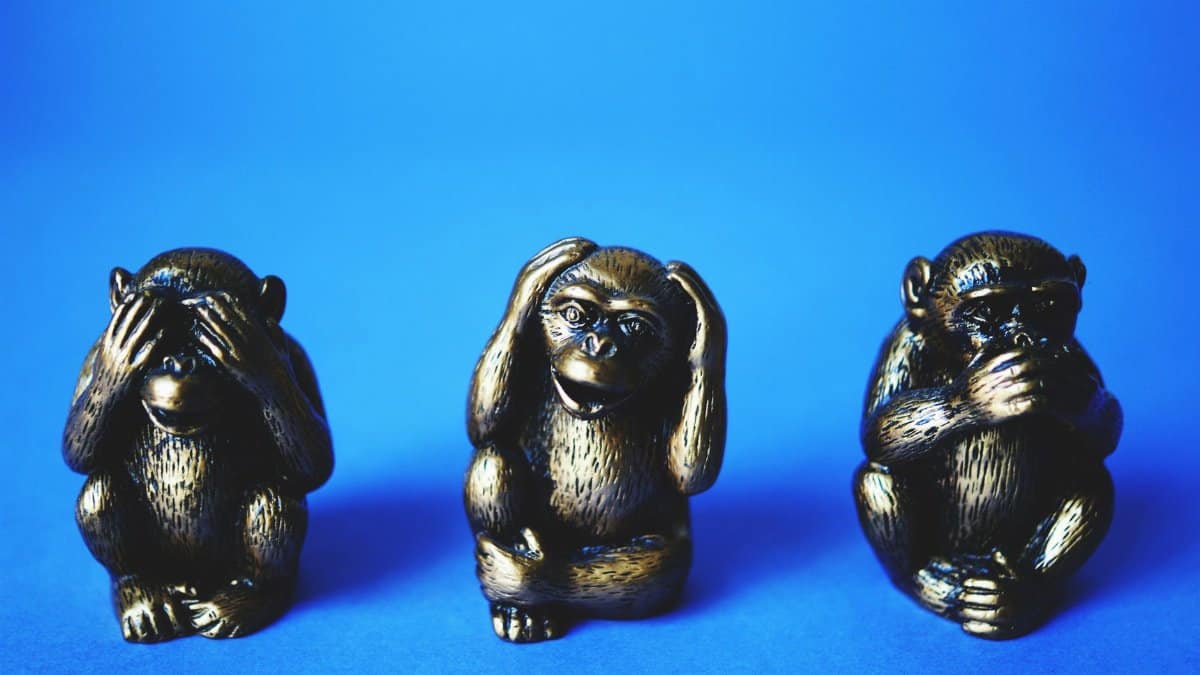 Close-up of the three wise monkeys bronze figurines symbolizing see no evil, hear no evil, speak no evil.